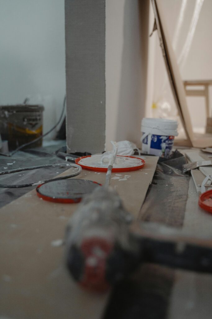 Close-up view of a construction site with tools and materials used for home renovation.